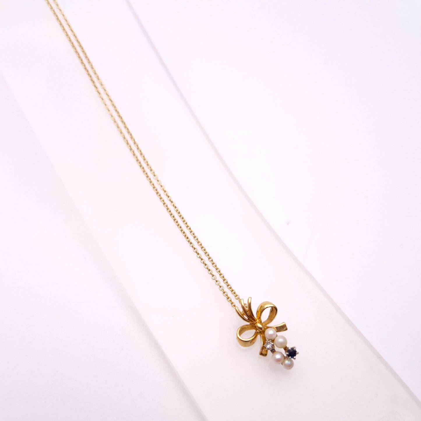 9ct Yellow Gold Sapphire , Diamond and Pearl Bow Pendant and chain Necklace