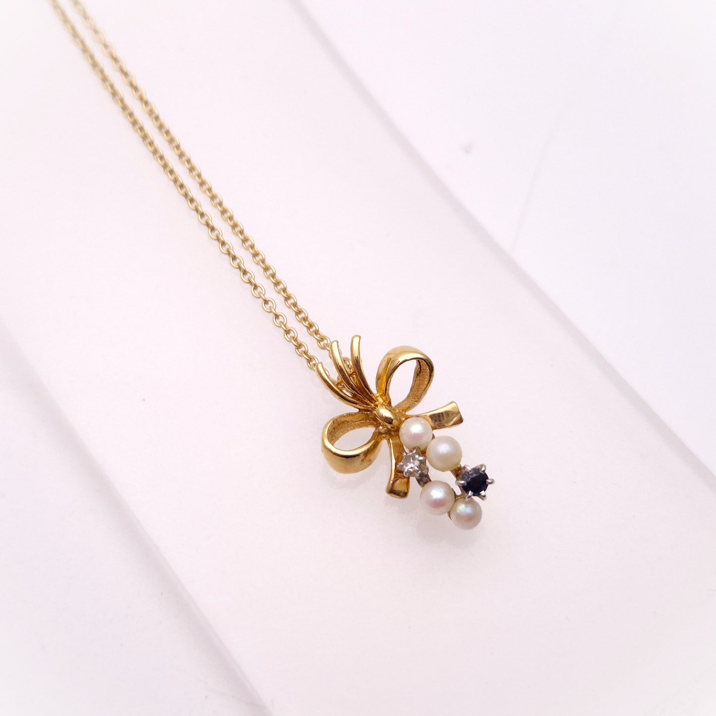 9ct Yellow Gold Sapphire , Diamond and Pearl Bow Pendant and chain Necklace