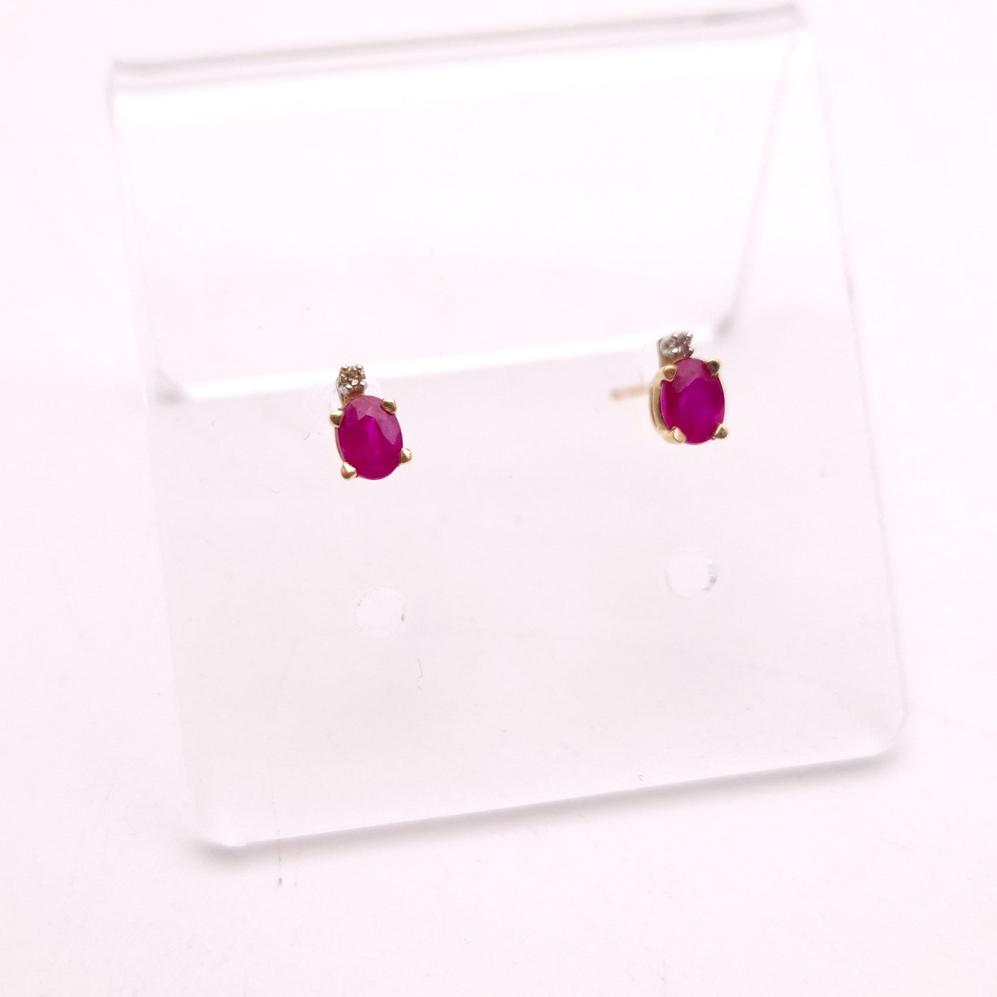 10ct Yellow Gold Oval Cut Ruby and Small Round Diamond Stud Earrings