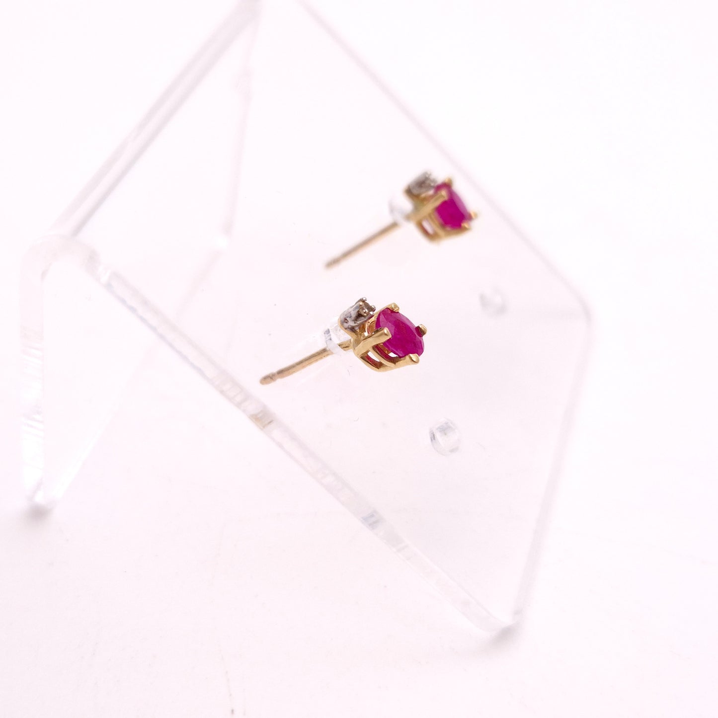 10ct Yellow Gold Oval Cut Ruby and Small Round Diamond Stud Earrings