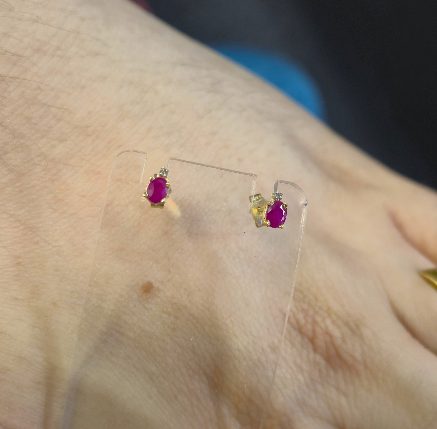 10ct Yellow Gold Oval Cut Ruby and Small Round Diamond Stud Earrings