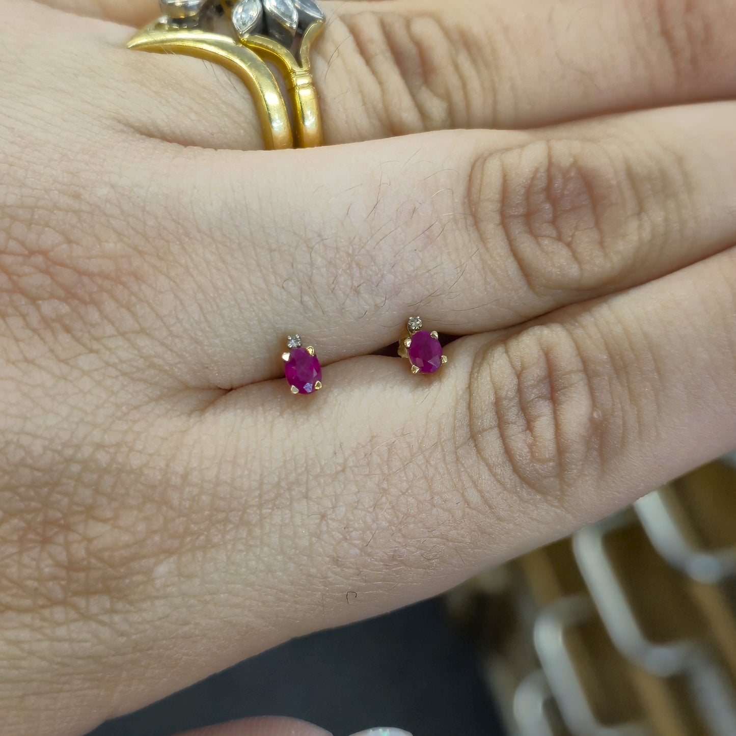 10ct Yellow Gold Oval Cut Ruby and Small Round Diamond Stud Earrings