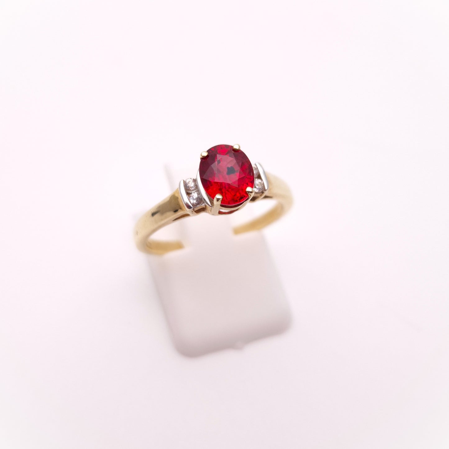 9ct Yellow Gold Red Garnet Solitaire and White Topaz Set Shoulders Ring