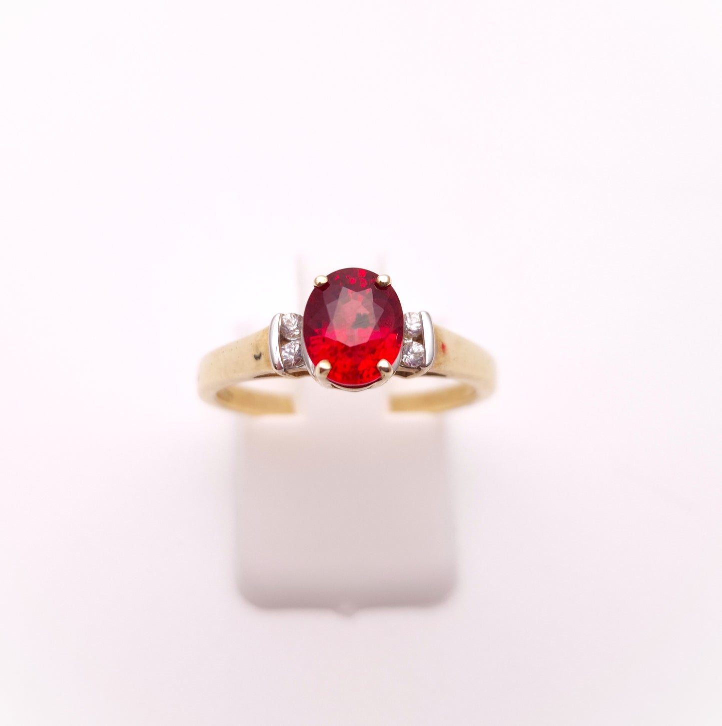 9ct Yellow Gold Red Garnet Solitaire and White Topaz Set Shoulders Ring