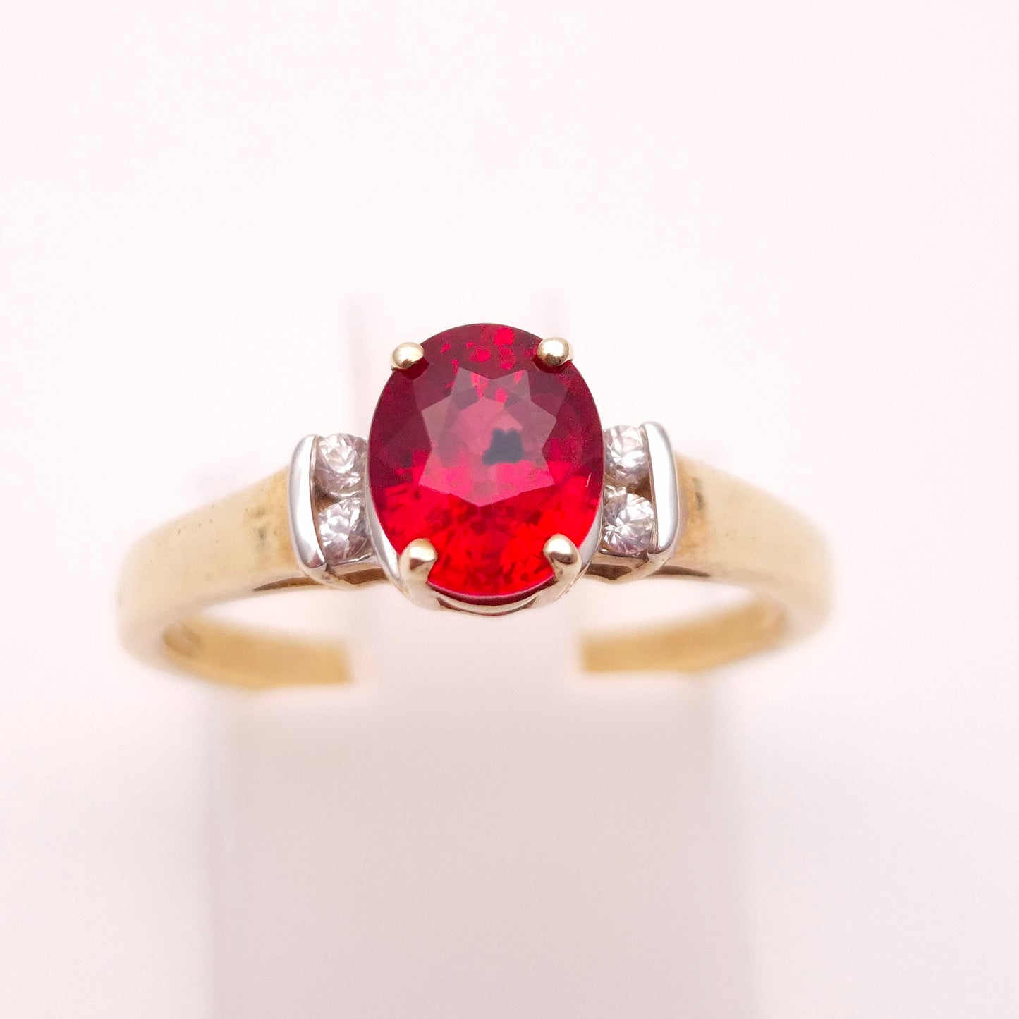 9ct Yellow Gold Red Garnet Solitaire and White Topaz Set Shoulders Ring