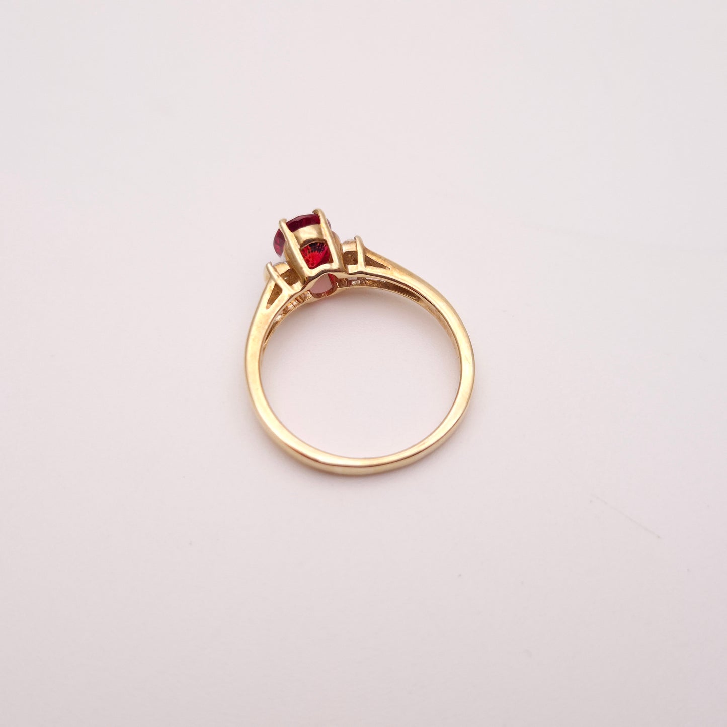 9ct Yellow Gold Red Garnet Solitaire and White Topaz Set Shoulders Ring