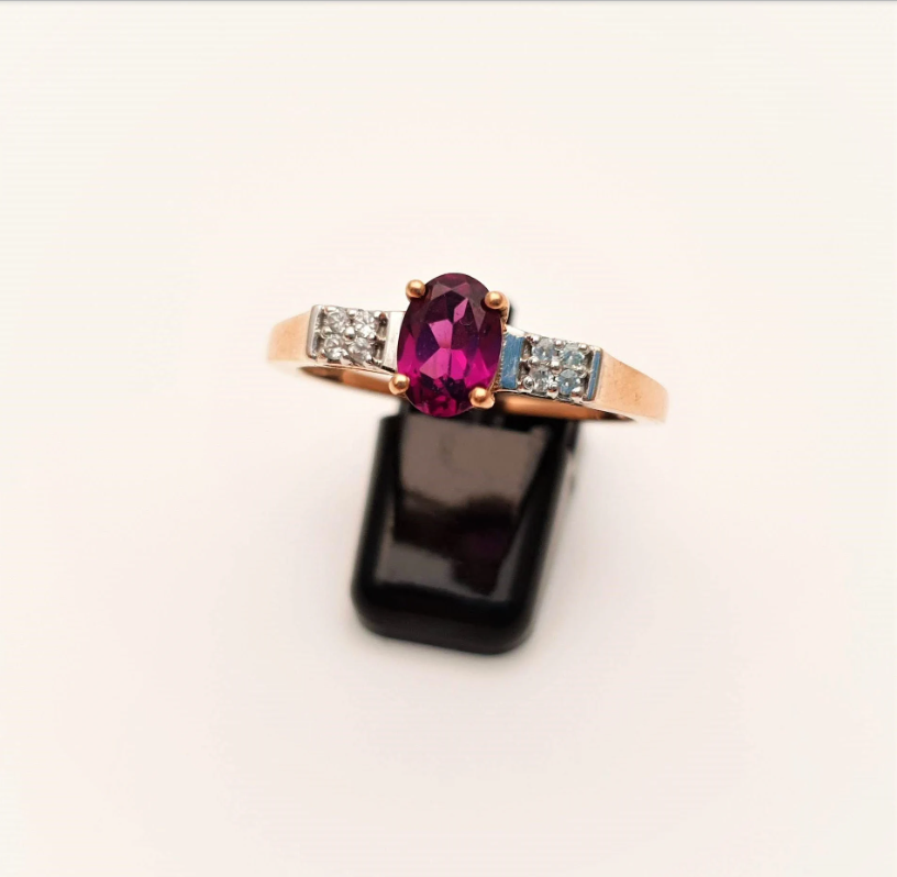 9ct Rose Gold Oval Garnet and white stone solitaire with accents ring