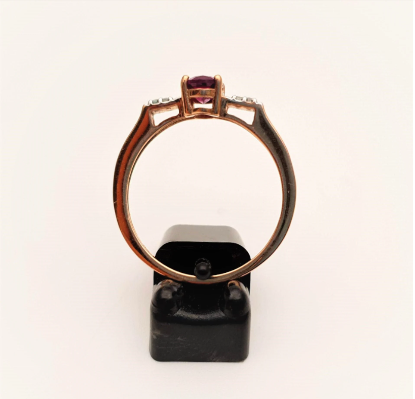 9ct Rose Gold Oval Garnet and white stone solitaire with accents ring