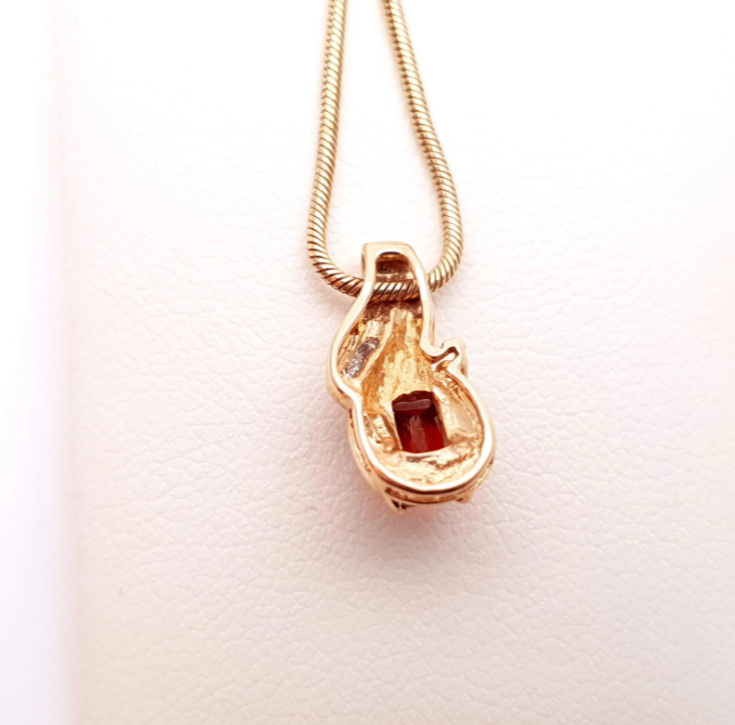 9ct yellow gold garnet and diamond two-tone pendant and chain necklace.