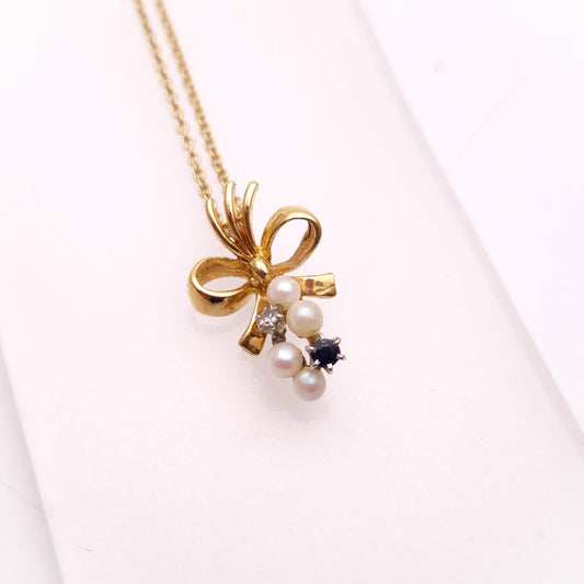 9ct Yellow Gold Sapphire , Diamond and Pearl Bow Pendant and chain Necklace