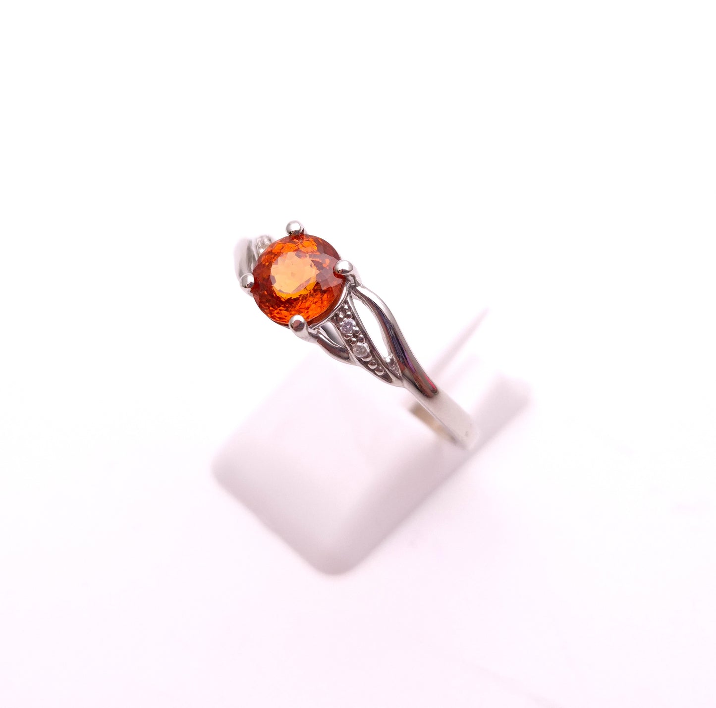 9ct White Gold Spessartite Garnet and White Stone Ring