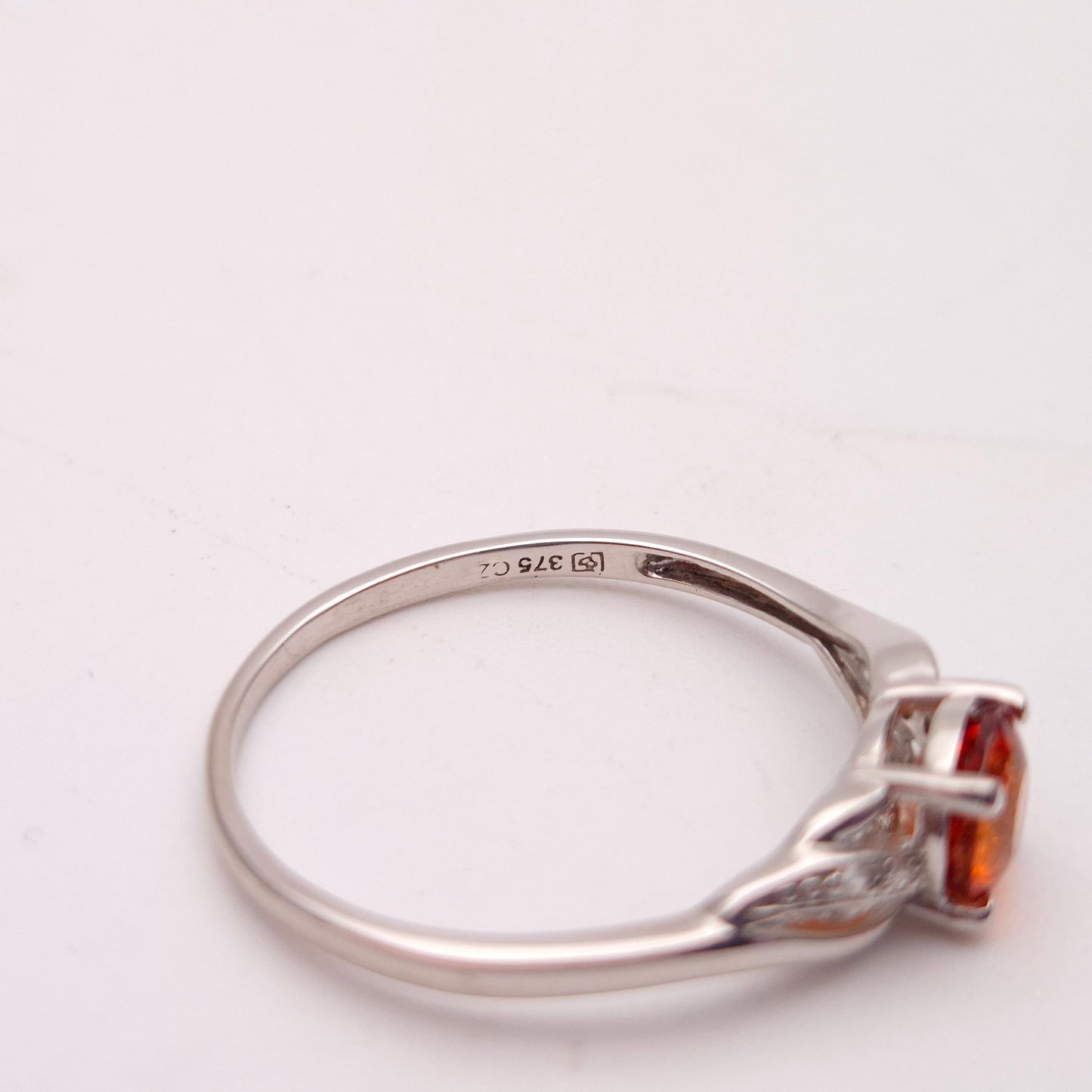 9ct White Gold Spessartite Garnet and White Stone Ring
