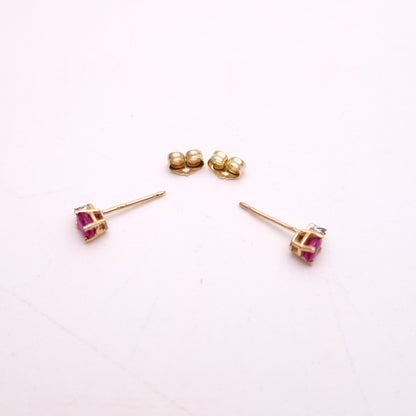 10ct Yellow Gold Oval Cut Ruby and Small Round Diamond Stud Earrings