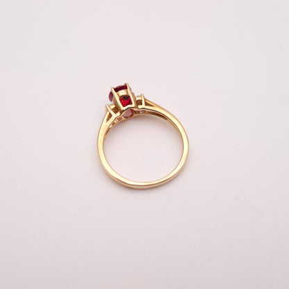 9ct Yellow Gold Red Garnet Solitaire and White Topaz Set Shoulders Ring