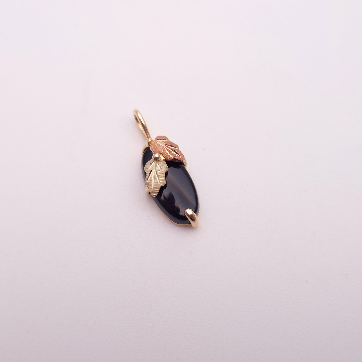 9ct Two-tone Yellow and Rose Gold Leaf Detail Oval Onyx Pendant