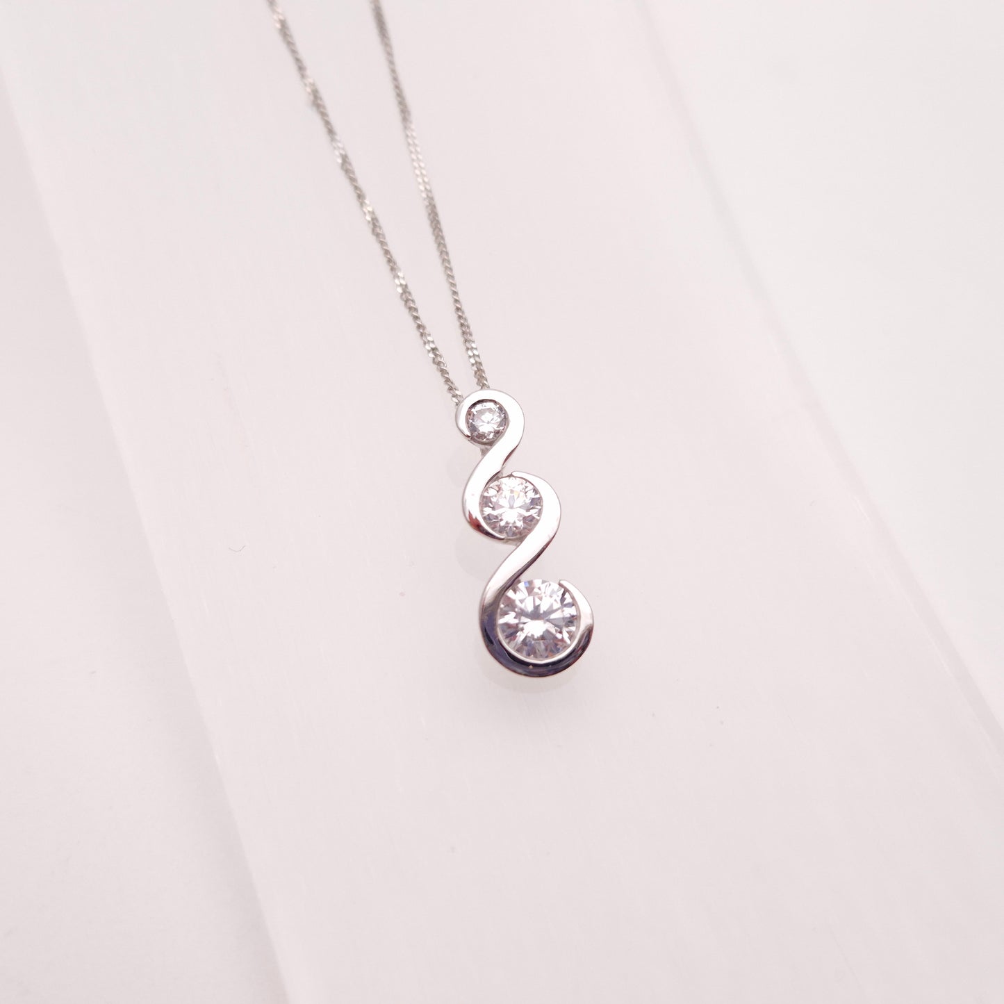 9ct White Gold Graduated Three Stone Cubic Zirconia Pendant and Chain Necklace