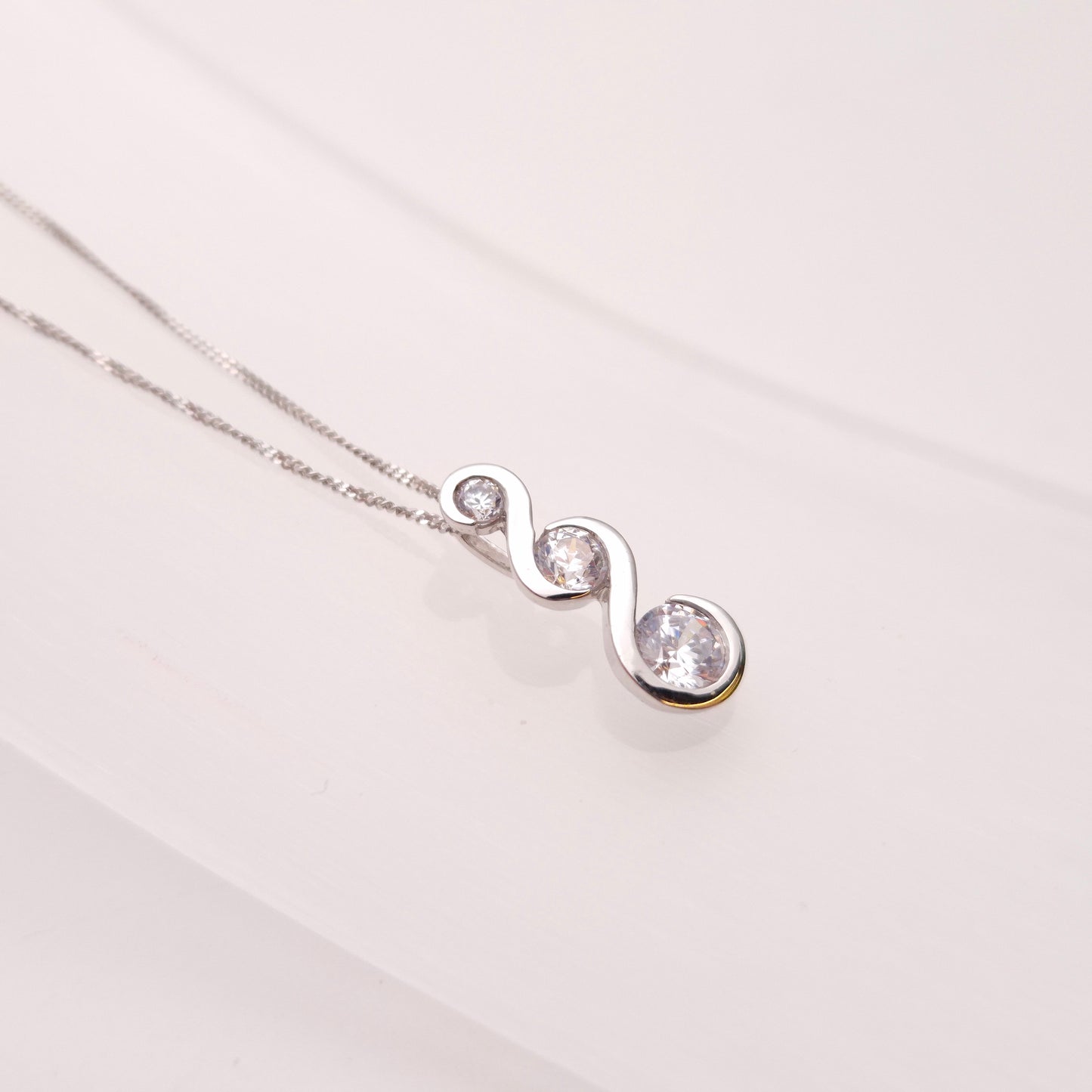 9ct White Gold Graduated Three Stone Cubic Zirconia Pendant and Chain Necklace