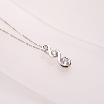 9ct White Gold Graduated Three Stone Cubic Zirconia Pendant and Chain Necklace