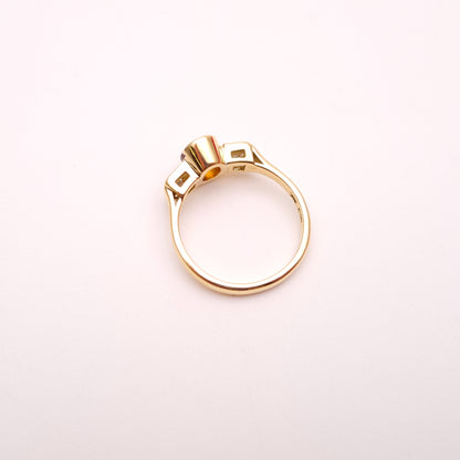 18ct Yellow Gold Oval Cut Orange Sapphire and Princess Cut Diamond Trilogy Ring
