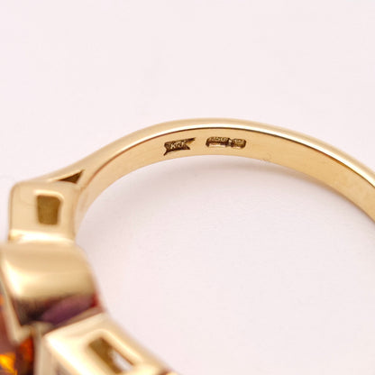 18ct Yellow Gold Oval Cut Orange Sapphire and Princess Cut Diamond Trilogy Ring