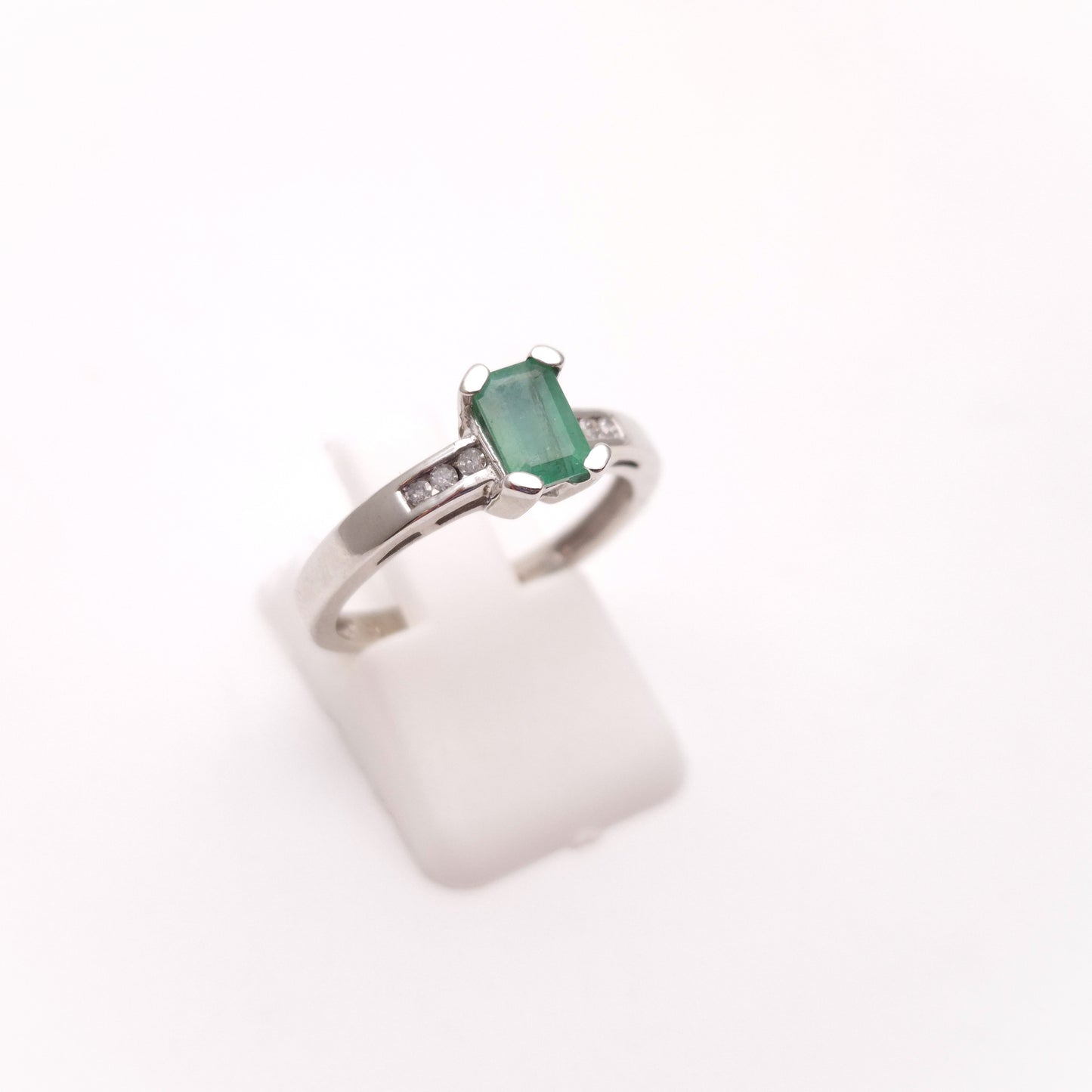 18ct White Gold Emerald Cut Emerald and Diamond Set Shoulders Ring