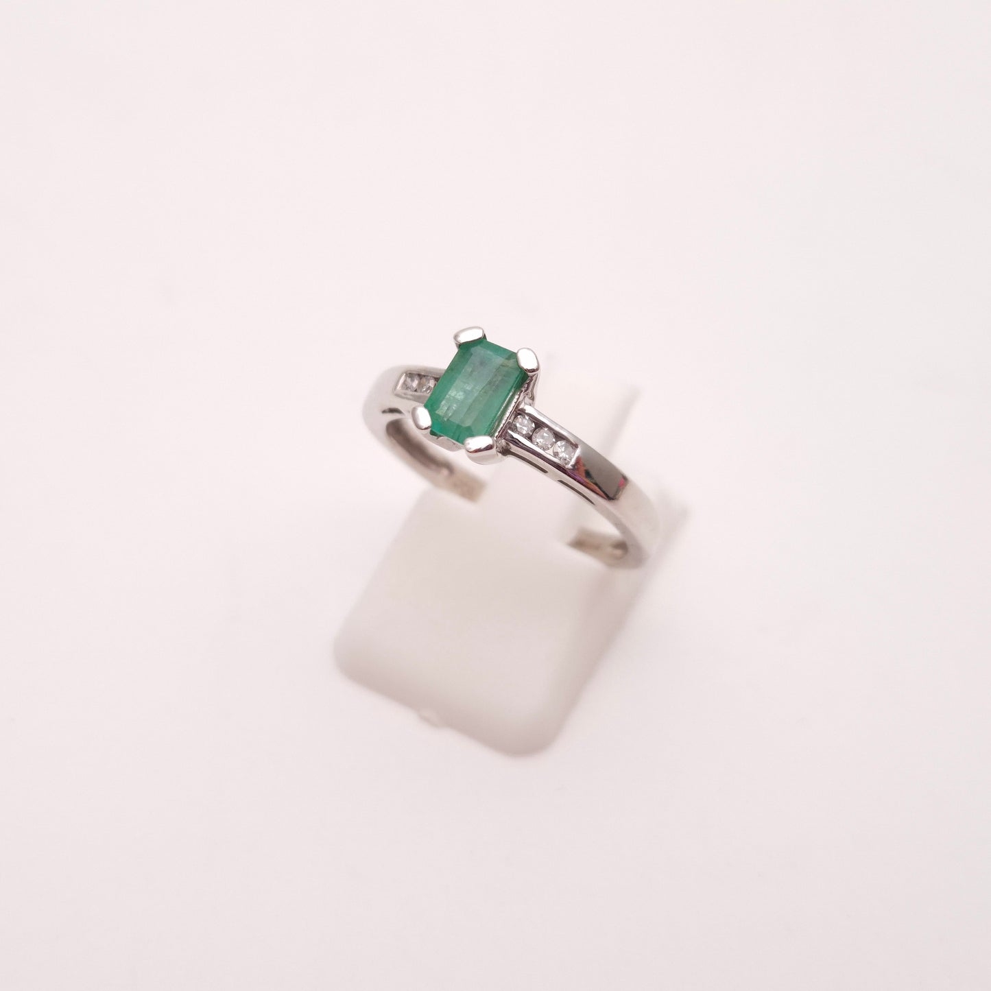 18ct White Gold Emerald Cut Emerald and Diamond Set Shoulders Ring