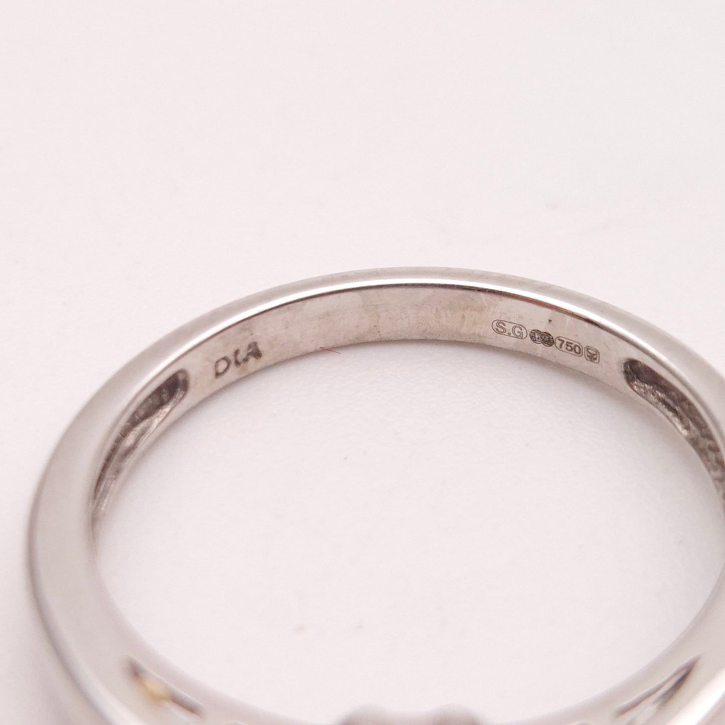 18ct White Gold Emerald Cut Emerald and Diamond Set Shoulders Ring