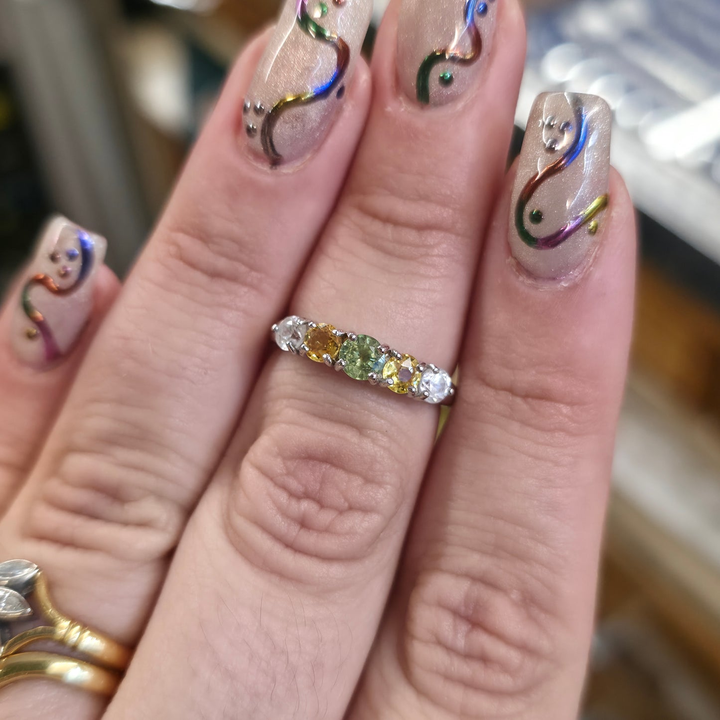 9ct White Gold Vari-Hue Green , Yellow, White Sapphire Five Stone Row Ring