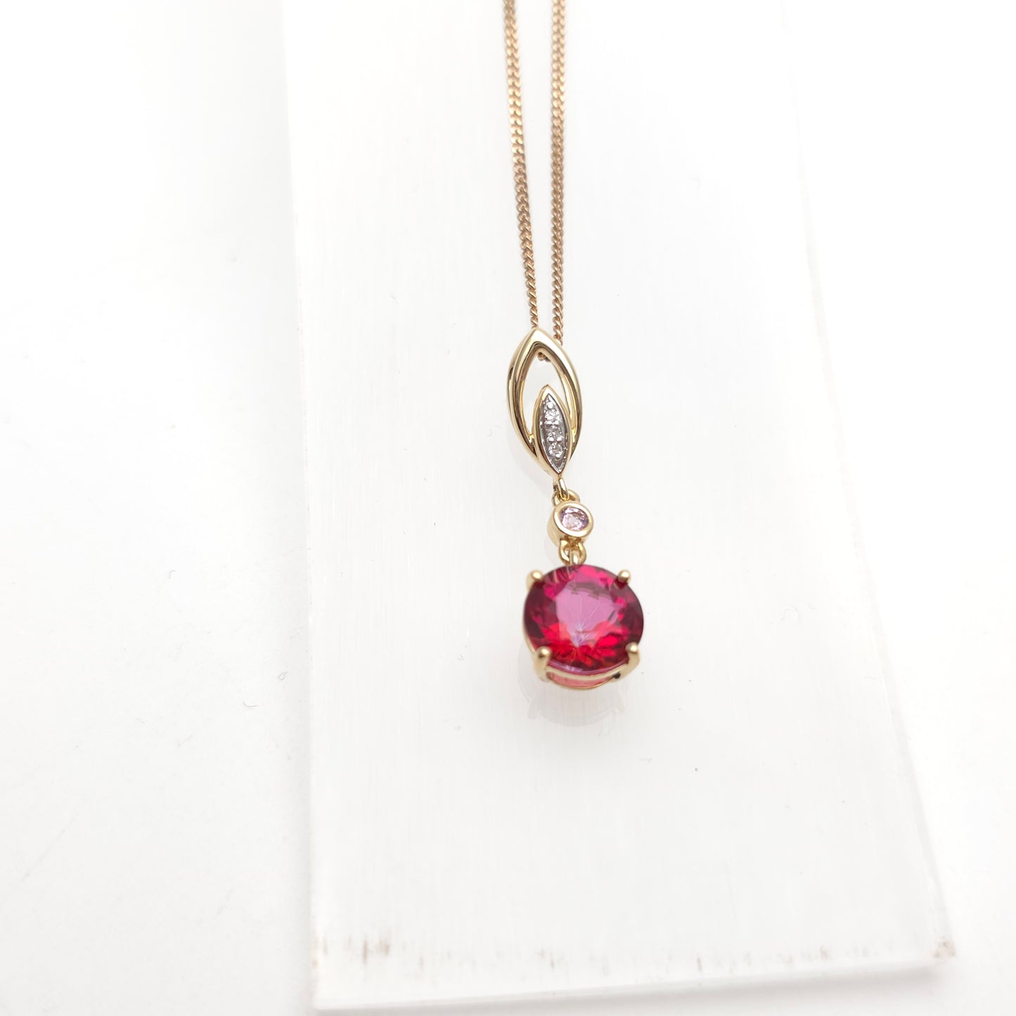 14ct Yellow Gold Red and Pink Topaz And Diamond Pendant on 9ct Gold Curb Chain