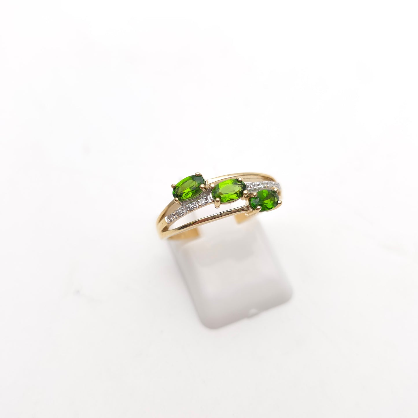 9ct Yellow Gold Three Oval Cut Green Stone (likely Garnet) and Diamond Ring
