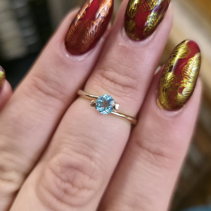 9ct Yellow Gold Small Blue Round Cut Stone with Heart Claws Solitaire Ring