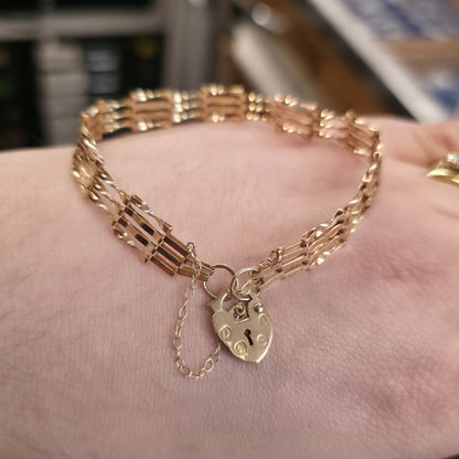 9ct Yellow Lightweight Slimline Twisted Link Gate Bracelet With Heart Lock Catch
