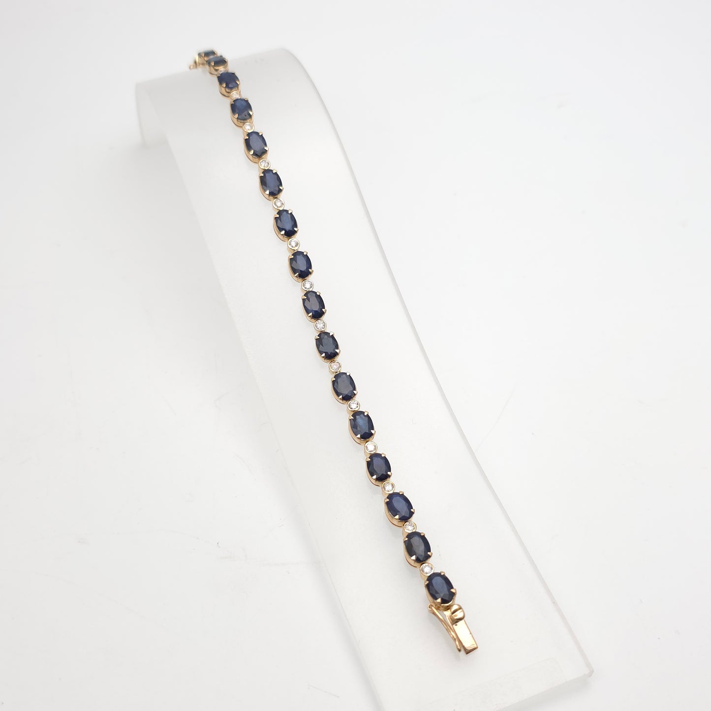 18ct Yellow Gold Oval Cut Sapphire And Small Round Cut Diamond Tennis Bracelet