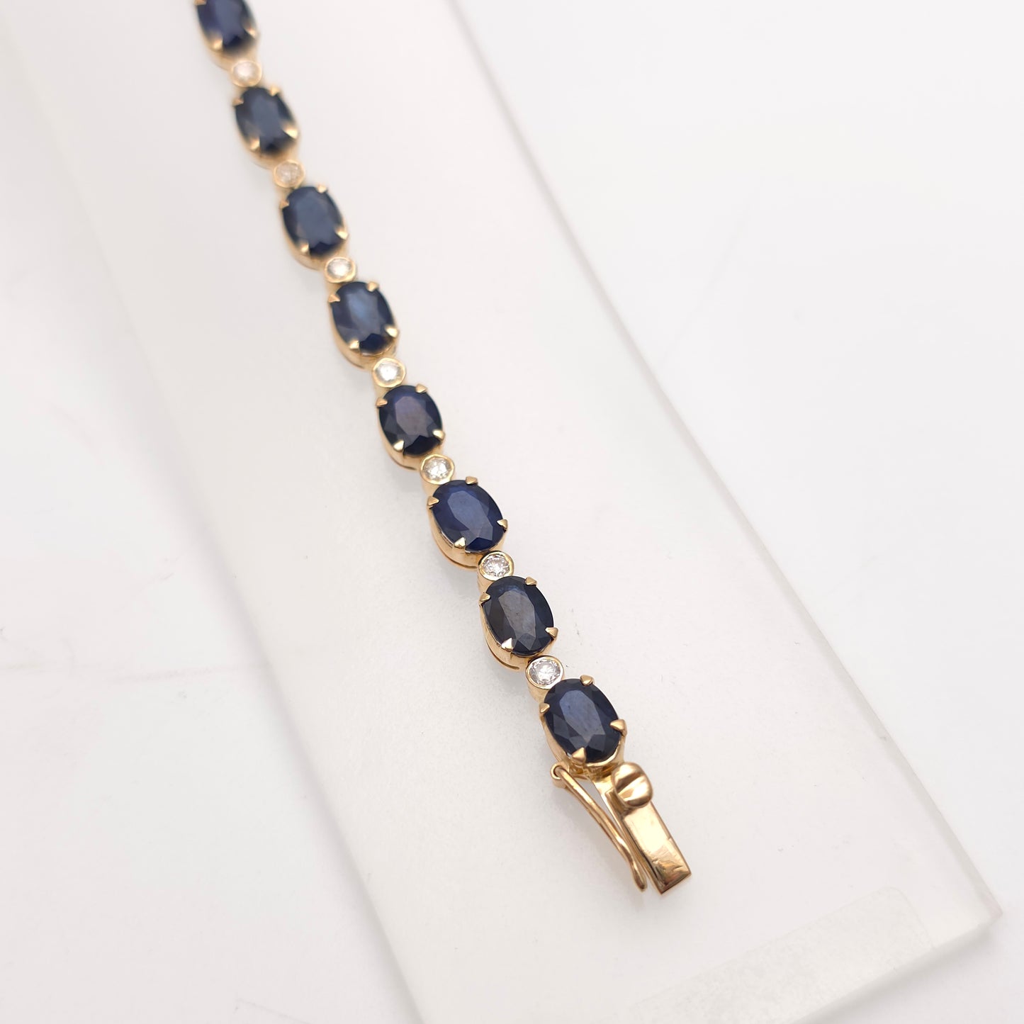 18ct Yellow Gold Oval Cut Sapphire And Small Round Cut Diamond Tennis Bracelet