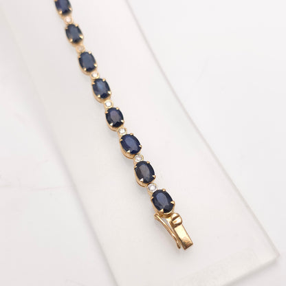 18ct Yellow Gold Oval Cut Sapphire And Small Round Cut Diamond Tennis Bracelet