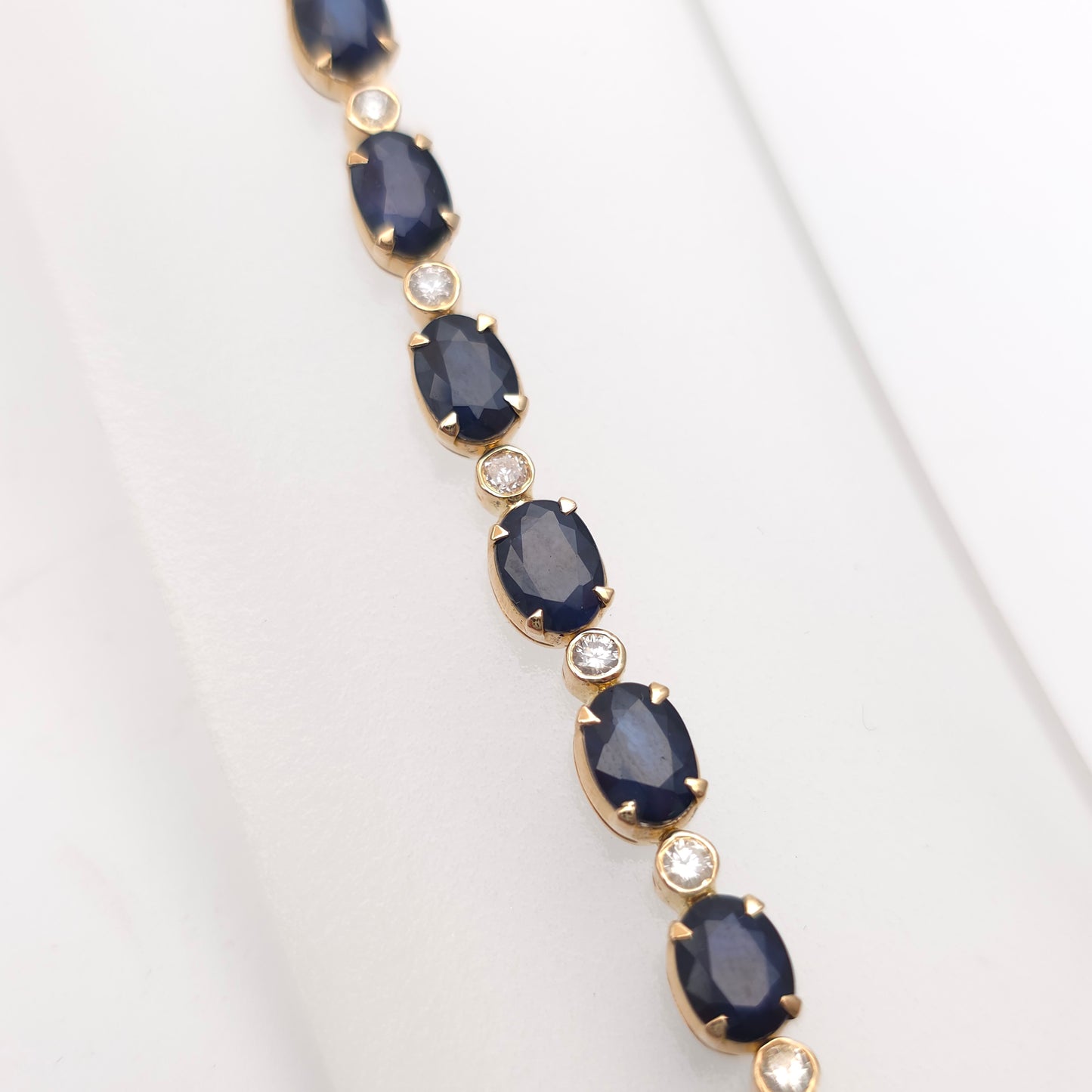 18ct Yellow Gold Oval Cut Sapphire And Small Round Cut Diamond Tennis Bracelet