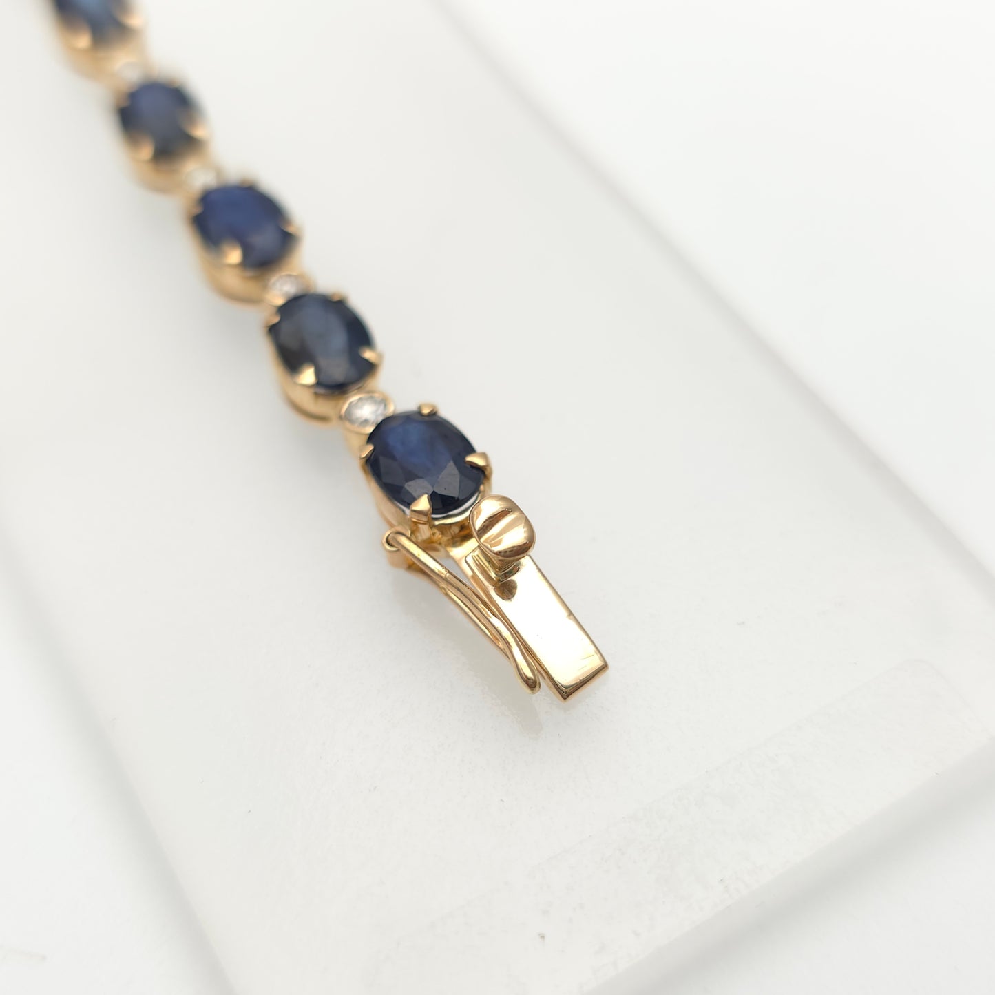 18ct Yellow Gold Oval Cut Sapphire And Small Round Cut Diamond Tennis Bracelet