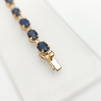 18ct Yellow Gold Oval Cut Sapphire And Small Round Cut Diamond Tennis Bracelet
