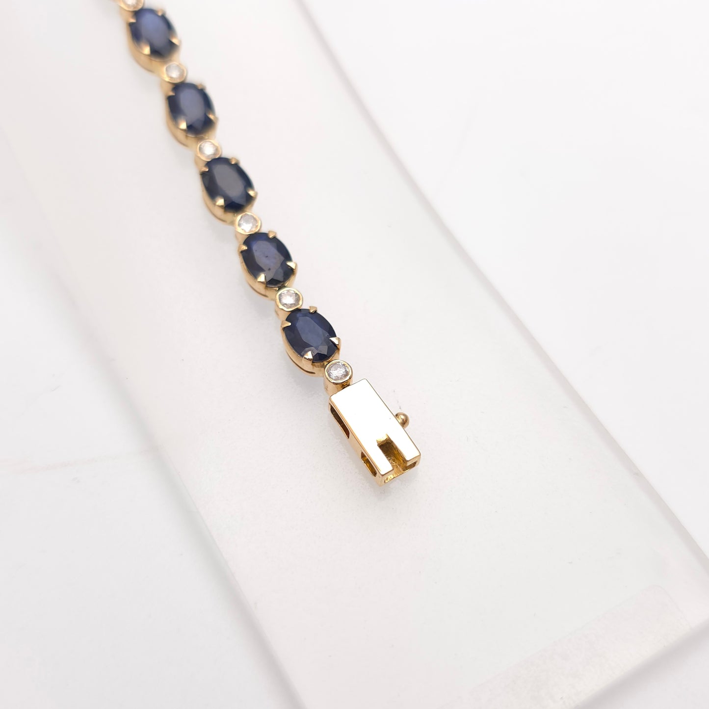 18ct Yellow Gold Oval Cut Sapphire And Small Round Cut Diamond Tennis Bracelet