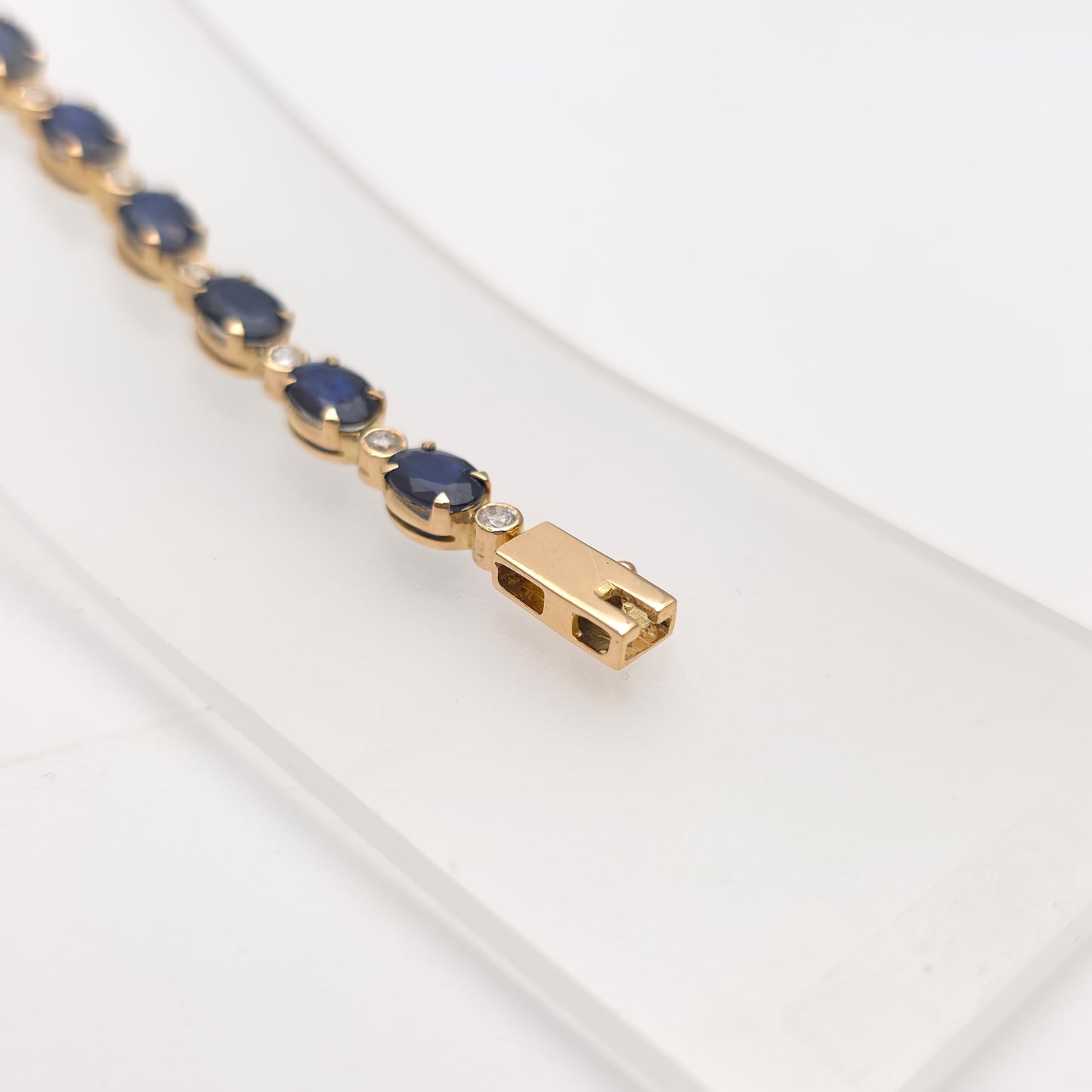 18ct Yellow Gold Oval Cut Sapphire And Small Round Cut Diamond Tennis Bracelet