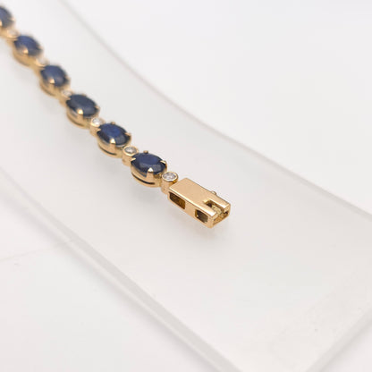 18ct Yellow Gold Oval Cut Sapphire And Small Round Cut Diamond Tennis Bracelet