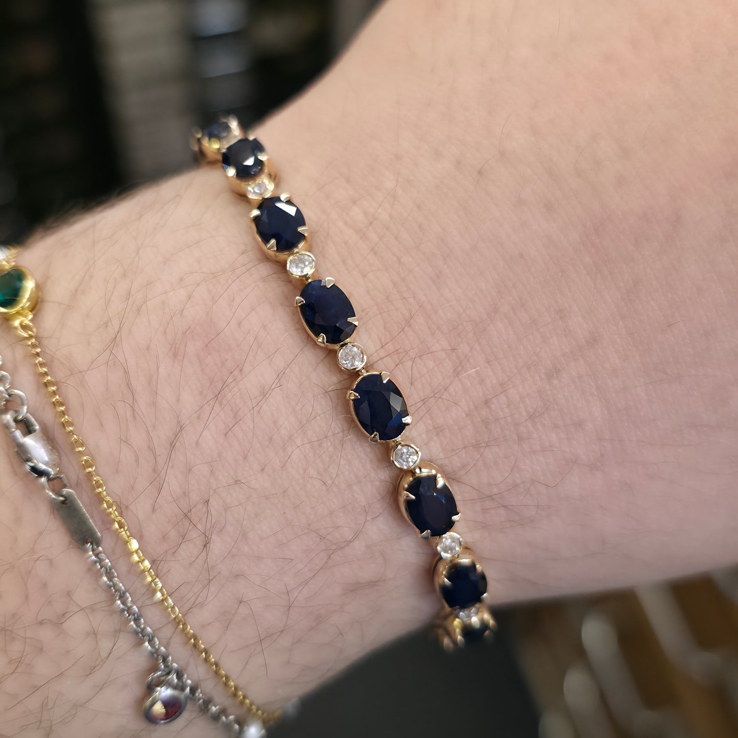 18ct Yellow Gold Oval Cut Sapphire And Small Round Cut Diamond Tennis Bracelet