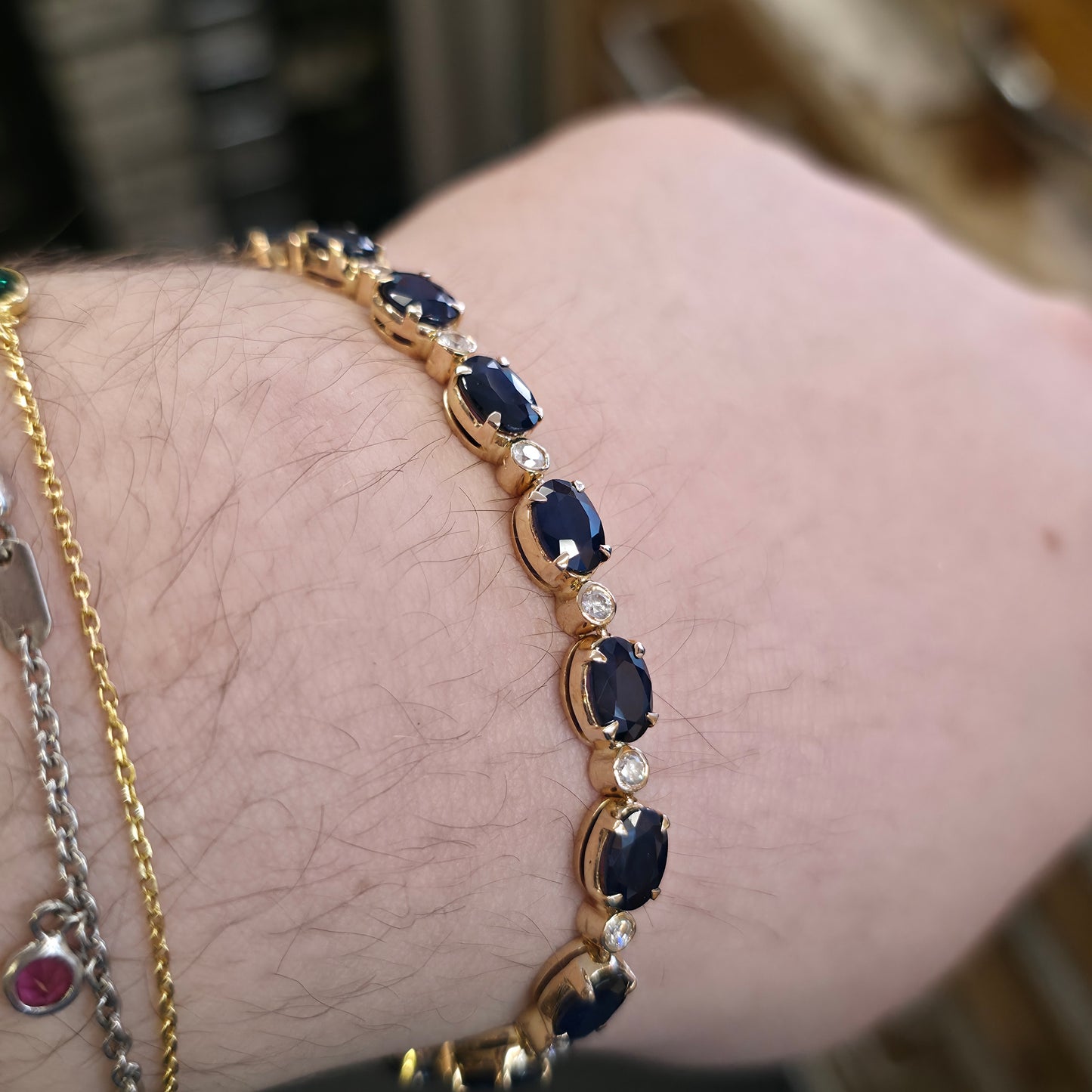 18ct Yellow Gold Oval Cut Sapphire And Small Round Cut Diamond Tennis Bracelet