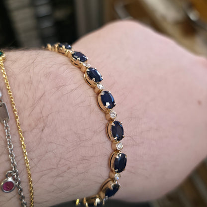 18ct Yellow Gold Oval Cut Sapphire And Small Round Cut Diamond Tennis Bracelet