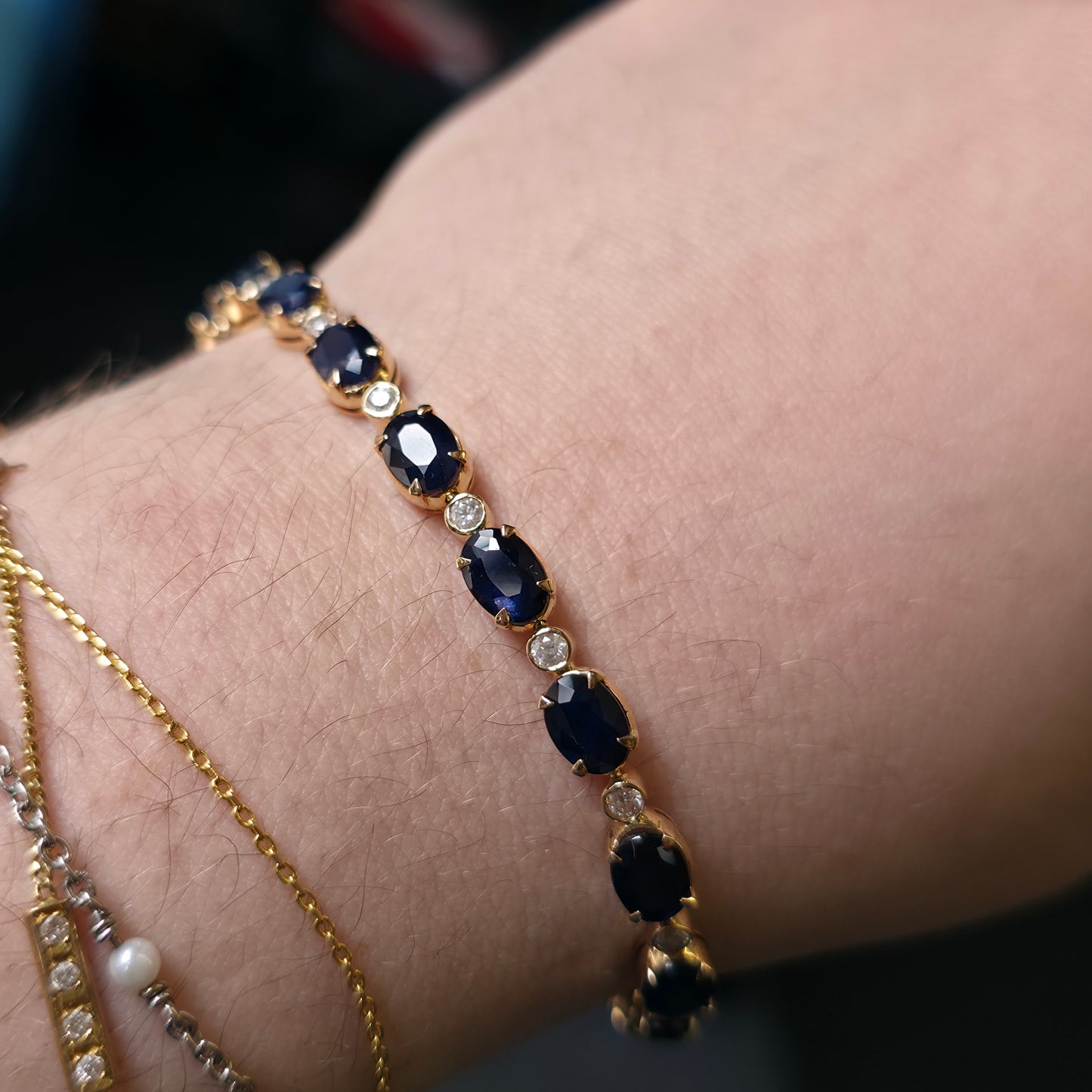 18ct Yellow Gold Oval Cut Sapphire And Small Round Cut Diamond Tennis Bracelet
