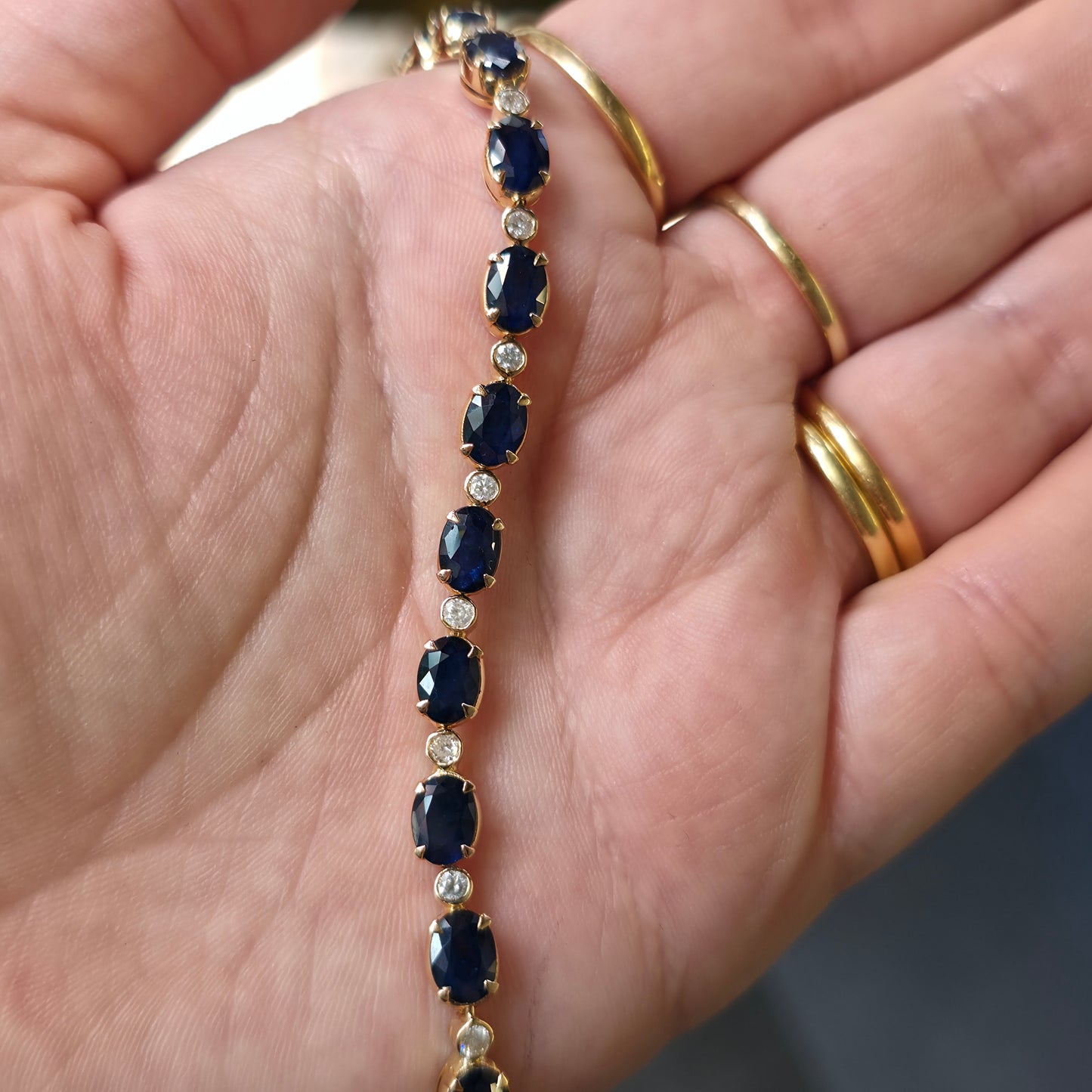 18ct Yellow Gold Oval Cut Sapphire And Small Round Cut Diamond Tennis Bracelet