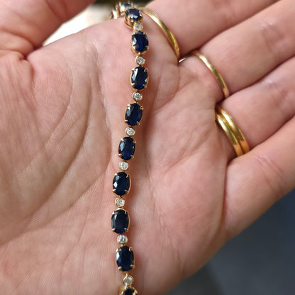 18ct Yellow Gold Oval Cut Sapphire And Small Round Cut Diamond Tennis Bracelet