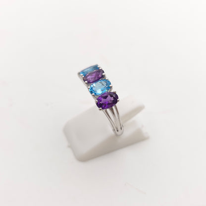 9ct White Gold Oval Cut Blue Topaz And Amethyst Half Eternity Row Ring