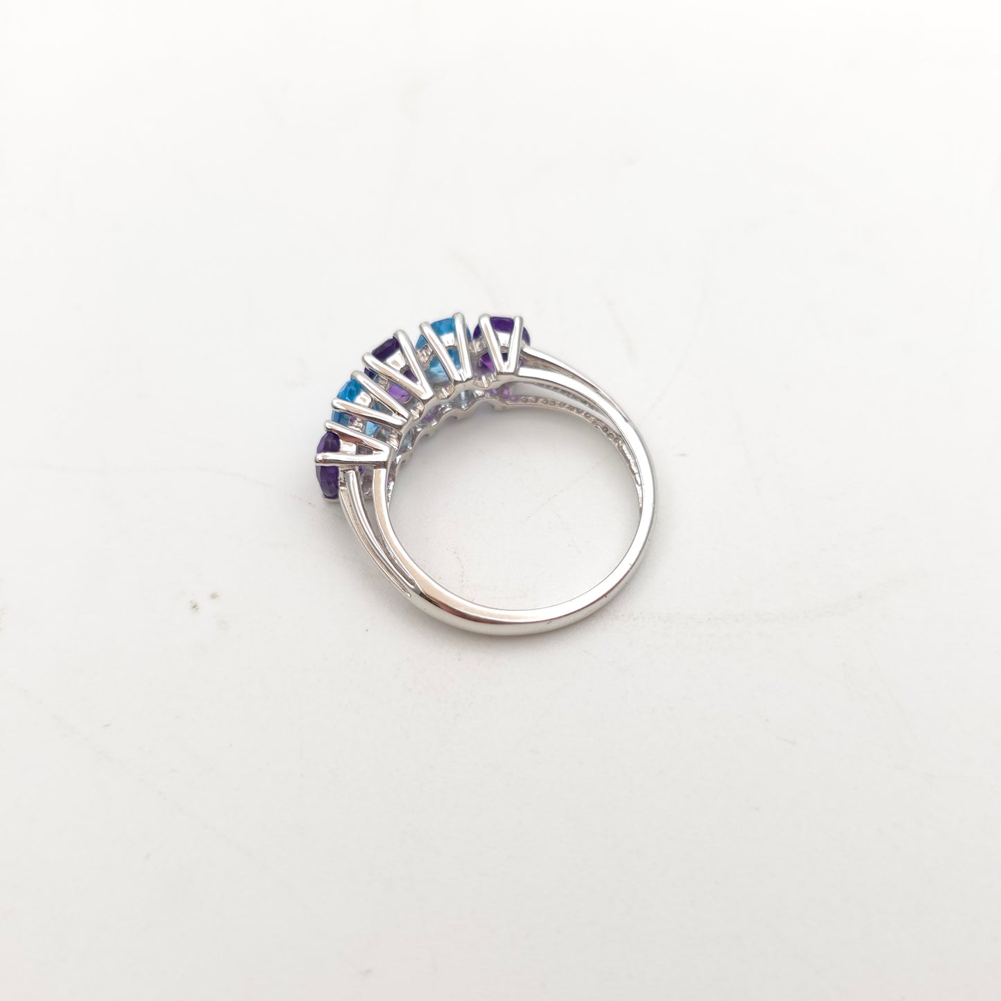 9ct White Gold Oval Cut Blue Topaz And Amethyst Half Eternity Row Ring