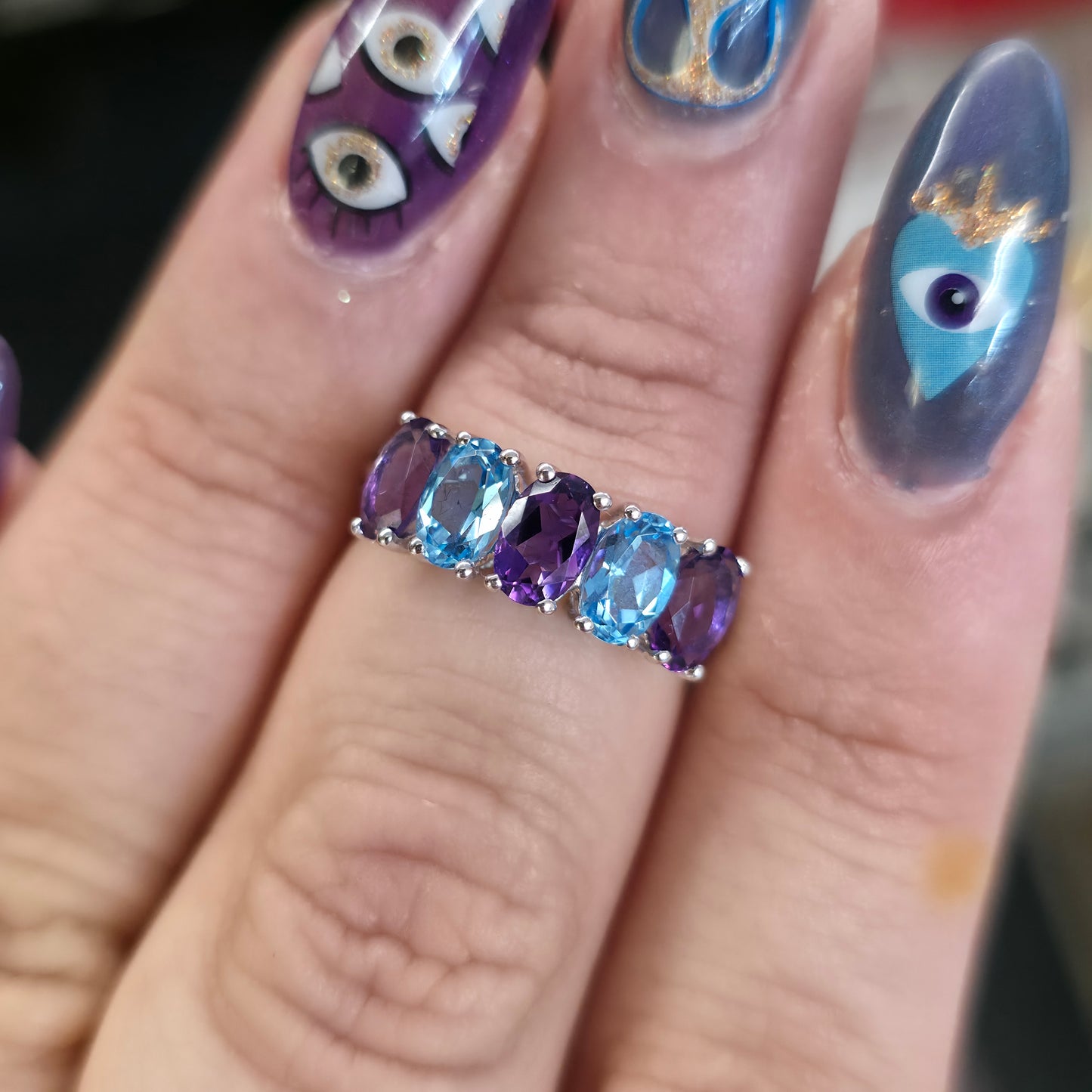 9ct White Gold Oval Cut Blue Topaz And Amethyst Half Eternity Row Ring